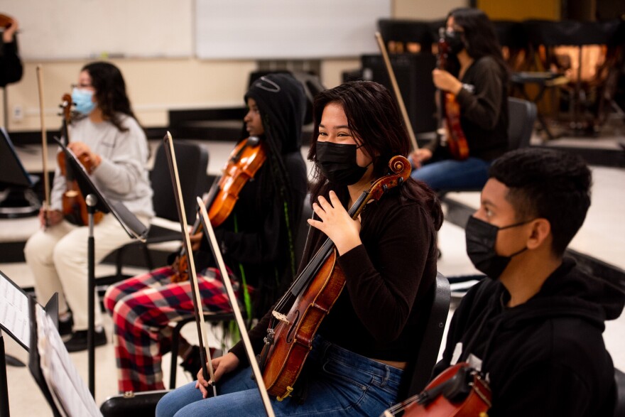 Angelee Montances, 12th grade, plays the viola during orchestra class at Richmond High School in Richmond on Wednesday, October 5, 2022. Richmond High School’s arts programming would benefit from Prop 28, a measure that would roughly double the amount of funding that California gives schools for arts and music education. “We could use it, desperately,” said Richmond High School music director Andrew Wilke. “To not have to worry about finances on top of teaching seven classes would make my job more manageable, which would make me a better teacher and the kids happier,” Wilke said.