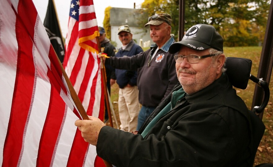 Disabled veteran Donald Simoneau participates in a fundraising event. Simoneau, who has been confined to a wheelchair for 35 years, is in favor of expanding Medicaid.