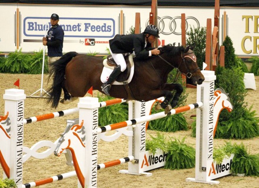 Todd Minikus and Sweetheart negotiated a fence during the Sasco Creek Farm International Open Jumpers $50,000 Welcome Stakes during the first day of competition at the Alltech National Horse Show at the Kentucky Horse Pa
