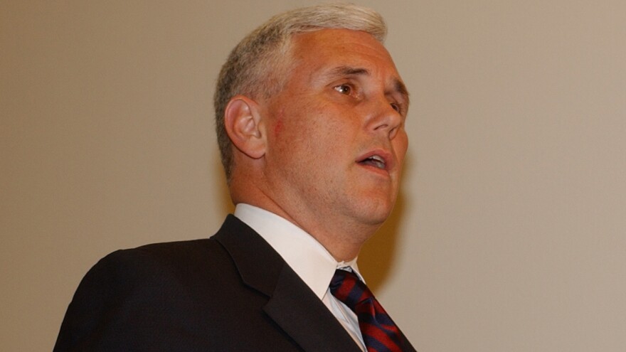 Then-Rep. Mike Pence talks to reporters on Capitol Hill on May 12, 2004, after viewing new photographs and videos of Iraqi prisoner abuse.