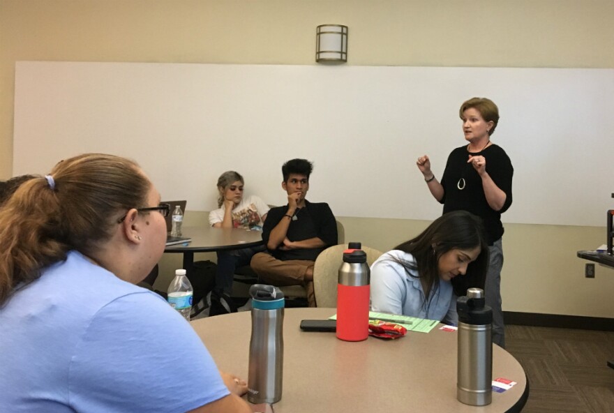 Karen Bassett, with the League of Women Voters, urges students at Eastfield College to register and vote.  Turnout in Texas of young voters is extremely low in a state with the lowest overall turnout in the nation.