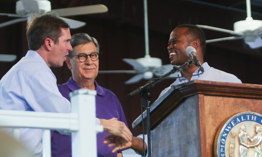 David Beck, center, served as the emcee of the 2023 Fancy Farm Picnic political speaking event, where Gov. Andy Beshear and then-GOP gubernatorial candidate Daniel Cameron spoke in front of a far western Kentucky crowd.
