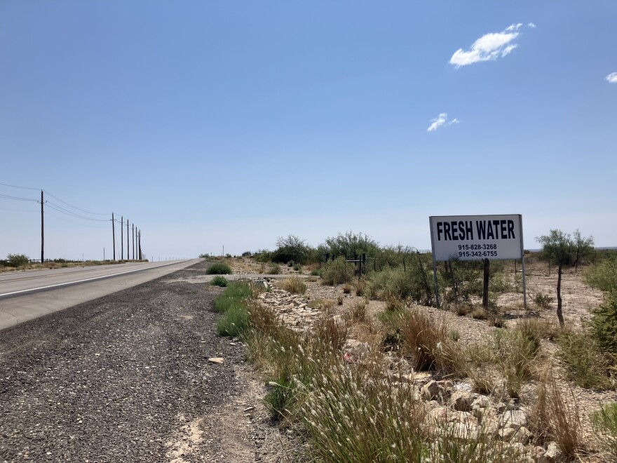A sign on the side of the highway in the Permian Basin advertises fresh water for sale. Fracking requires significant volumes of water to complete wells.