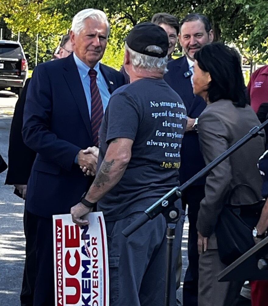 Nassau County Executive Bruce Blakeman, the Republican candidate for New York governor, greets Rick Sabourin of Hamlin on Sept. 18, 2026, in Greece before holding a news conference.