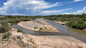 Sand and gravel bars in the Rio Grande expand in the river's reach through central New Mexico as monsoon clouds form north of Bernalillo, N.M., on Thursday, July 21, 2022. (AP Photo/Susan Montoya Bryan)
