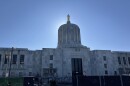 The Oregon Capitol. Construction equipment and fencing is seen in the foreground. 