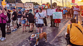 Demonstrators line Summer Avenue on Sunday to protest the El Corralon raid.