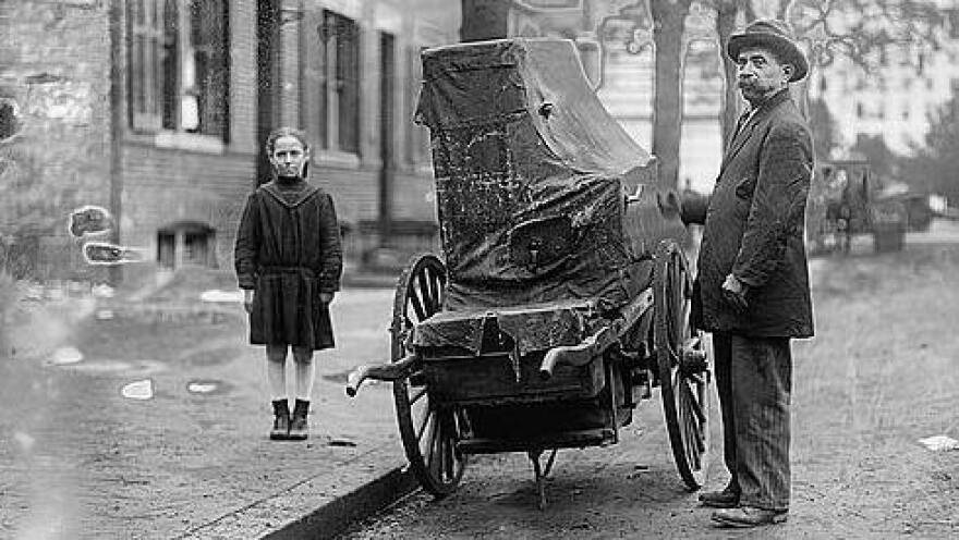 A child and organ grinder, date unknown.