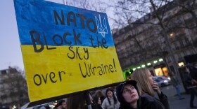 A protestor calls for on NATO to enforce a no-fly zone over the Ukraine during a demonstration in Paris, France, on Feb. 26, 2022. (Peter Dejong/AP)
