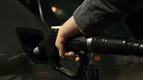 Pumping gasoline for a vehicle.