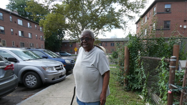 Mable Wilson, a 76 year old resident of the Pioneer Homes public housing complex in Syracuse, uses a cane to balance herself as a result of her hearing issues. The issue could be resolved with hearing aids, which she has gone years without.