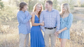 Tiffany Storrs (middle) with her family. Storrs is bilaterally deaf and has two cochlear implants.