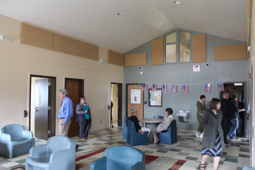 Committee members tour the common room in the high security Assessment and Stabilization Unit, or ASU.   Up to four residents share the building.  The furniture is designed to resist damage.