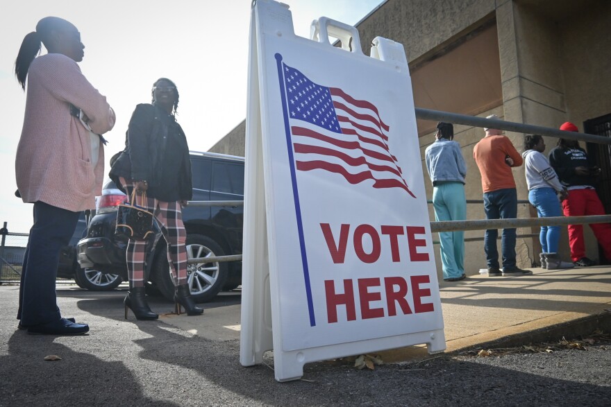 Voters cast early ballots at the Wyandotte County Election office in Kansas City, Kansas, in 2022. A recent Supreme Court ruling affirms a law prohibiting a person from returning more than 10 advance ballots for other people.