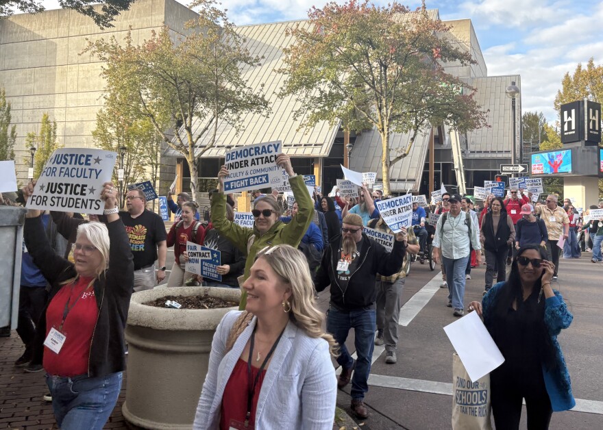 Rallyers marched through downtown Eugene chanting, "no contract, no peace" and "Eugene is a union town".