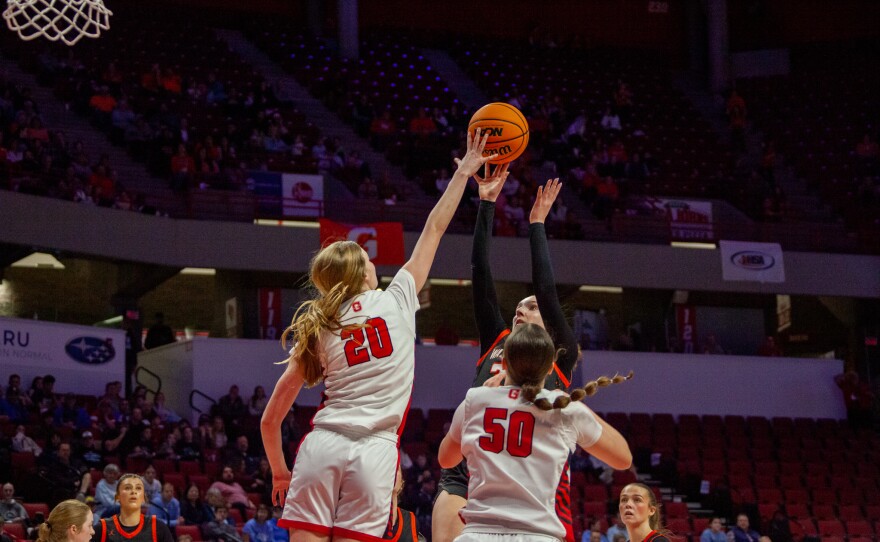 Girls high school basketball players inside an arena