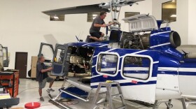 Mechanics work on a helicopter at Rotorcraft Support, Incorporated, a helicopter repair and maintenance facility in Fillmore.