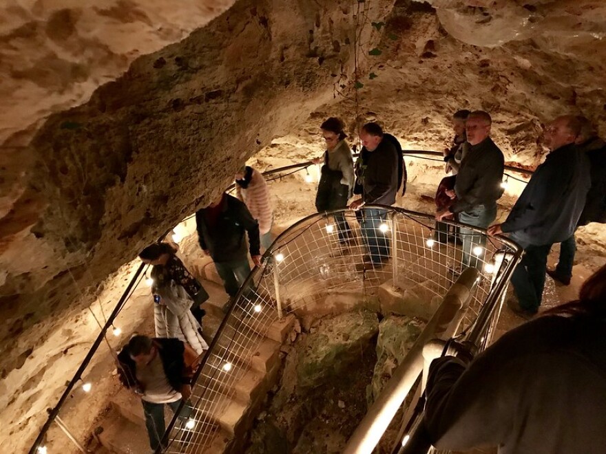 People descend into the cave for a concert