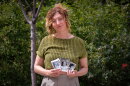 Salt Lake City-based artist Cara Despain holds photos of her mother Bonnie, Aug. 26, 2026. Bonnie Despain grew up in southern Utah 130 miles from the Nevada Test Site where 100 atmospheric nuclear tests were conducted in the years after WWII. She died in February of ALS, and a fragment of her bones was found to contain an abnormal amount of cesium, which can be formed in a nuclear reaction.