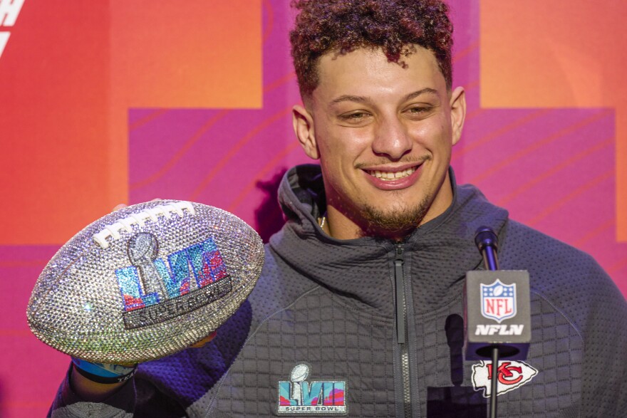 Kansas City quarterback Patrick Mahomes shows off a Super Bowl LVII bling ball while talking with the media at Footprint Center on February 6, 2023 in Phoenix, Arizona.