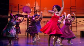 RhonniRose Mantilla, wearing a red dress, rehearses Thursday night for an upcoming community production of West Side Story in July.