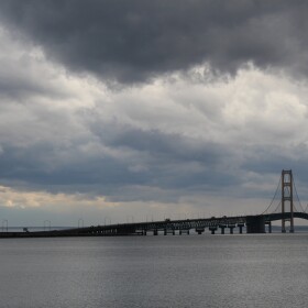 The Mackinac Bridge on a stormy day, with dark rain clouds overhead