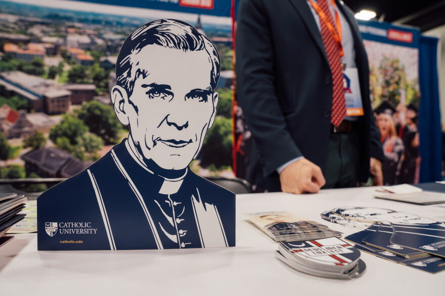 A display featuring the late Archbishop Fulton J. Sheen is shown at a Catholic University booth during an expo ahead of his beatification Mass on Thursday at the Dome at America's Center in downtown St. Louis. Sheen studied at Catholic University in 1920 and later returned to teach philosophy and theology there for 23 years, from 1926 to 1950.