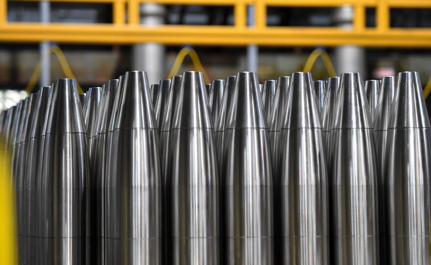 155-millimeter artillery shells are glazed with chrome and copper before they are painted Army green.