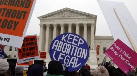 Pro-abortion rights signs are seen during the March for Life 2016, in front of the U.S. Supreme Court, Friday, Jan. 22, 2016 in Washington, during the annual rally on the anniversary of 1973 'Roe v. Wade' U.S. Supreme Court decision legalizing abortion.