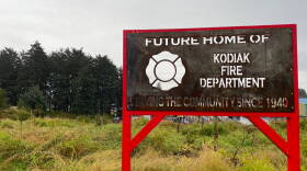A sign marks the site where Kodiak's new firehouse will sit, on MIll Bay Road and out of the tsunami inundation zone. (Photo: Kirsten Dobroth/KMXT)