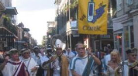 The Krewe of Cork parades during NOWFE's Royal Street Stroll.