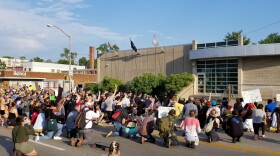 Protesters gather in front of the Bloomington Police Department Tuesday.