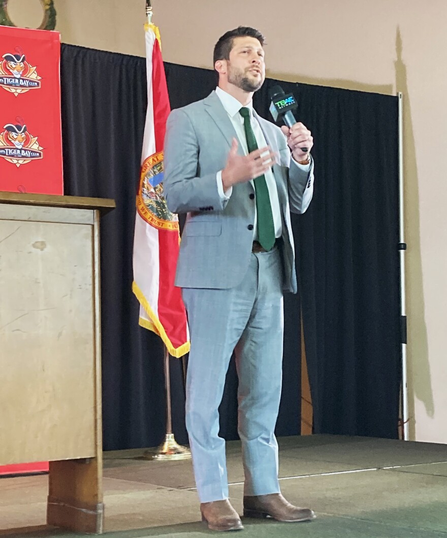 Man speaking on a stage