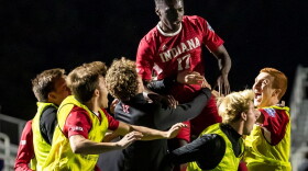 Indiana's Herbert Endeley is hoisted by teammates after scoring against Pitt in the NCAA soccer semifinals Friday night.