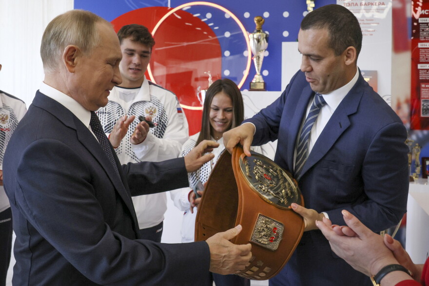 Russian President Vladimir Putin, left, and General Secretary of the Russian Boxing Federation, member of the Executive Committee of the International Boxing Association (AIBA) Umar Kremlev attend an opening of the new International Sambo and Boxing centre at the Luzhniki Sports Complex in Moscow, Russia, Saturday, Sept. 10, 2022. (Gavriil Grigorov, Sputnik, Kremlin Pool Photo via AP)