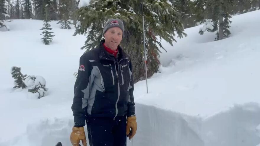 Chad Brackelsberg digs a snow pit near Reid Peek in the Uintas to evaluate snow stability.