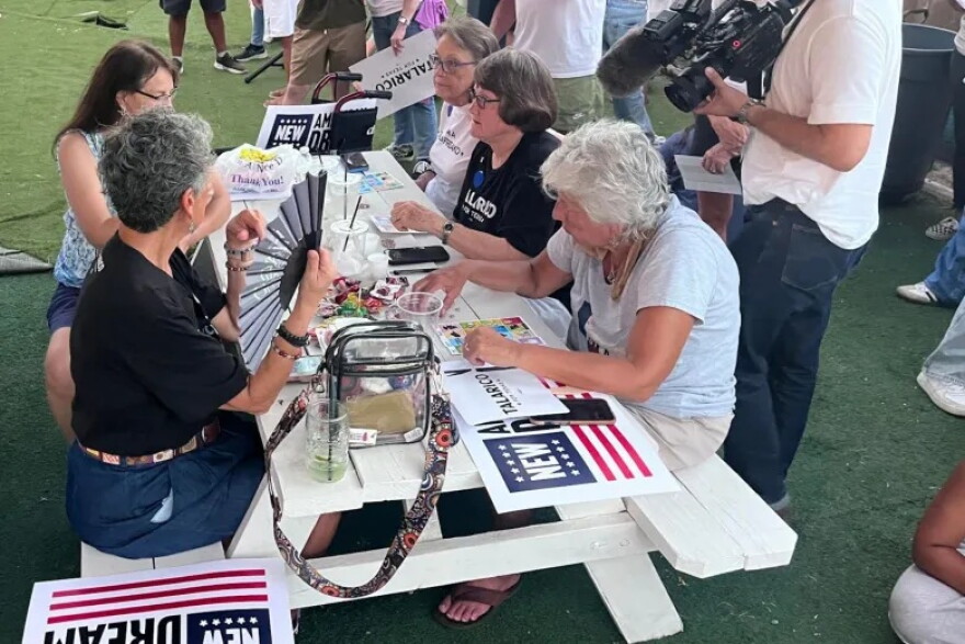 Supporters of Democrat James Talarico play a game of lotería at Backyard on Broadway.