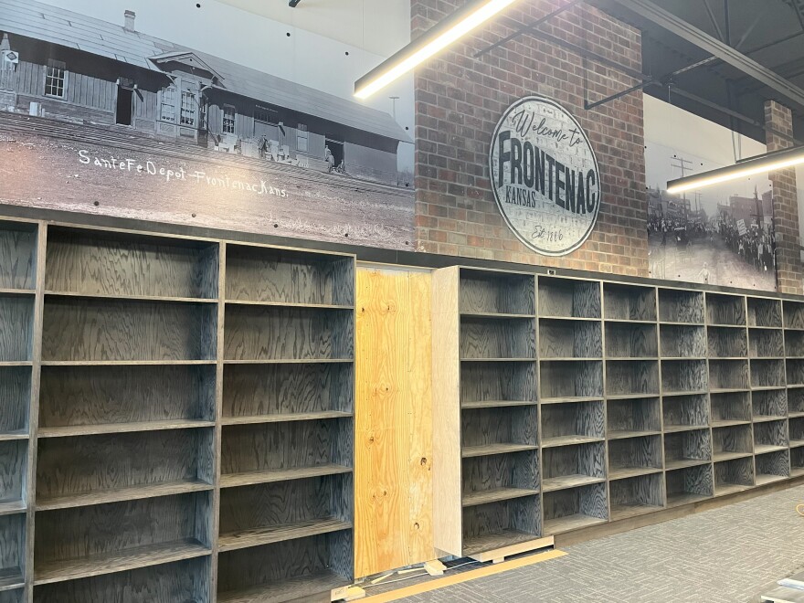 Empty shelves await books at the Frontenac Public Library.