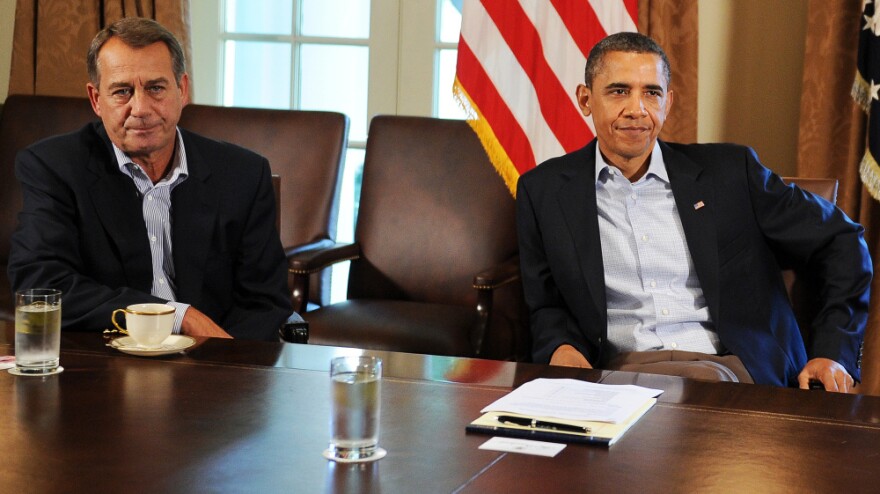 House Speaker John Boehner, R-Ohio, and President Obama at the White House on a Saturday in July, a day after Obama told reporters he had been "left at the altar" by Boehner.