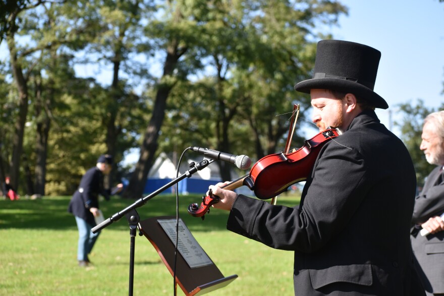 Seth Coquit, a Peoria Heights High School music teacher, plays "Ashokan Farewell" on his violin.