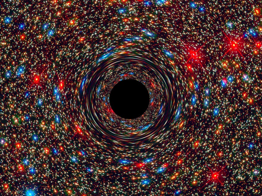 Computer-simulated image of a supermassive black hole at the core of a galaxy.