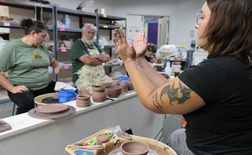 JaiDe Brown leads a cermanics demonstration during a recent class at City Arts in downtown Wichita. The six week course takes students through pottery basic throwing techniques to build pots, bowls, plates and other vessels.