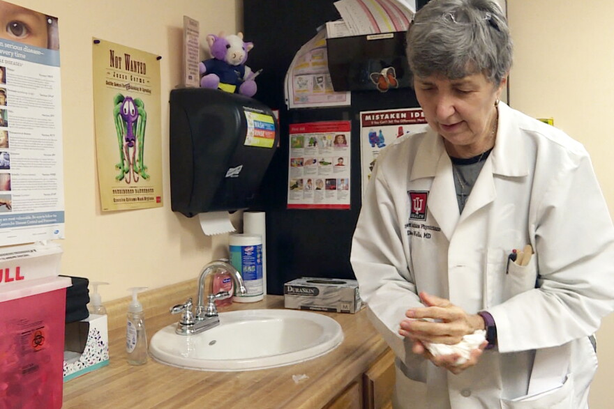 Dr. Barbara Diane Wells finishes washing her hands, a task she says can go a long way to preventing the spread of coronavirus.