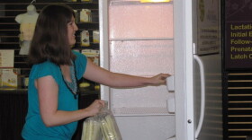 Krista Citron makes the first donation to the Milk Depot at Mother Nurture in Lexington.