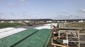 Barges float on the McClellan-Kerr Navigation system at the Port of Catoosa near Tulsa, Okla. Barges hold 15,000 tons of soybeans, grain or fertilizer. Because of the lower costs and connection to the coast, farmers rely on the system.