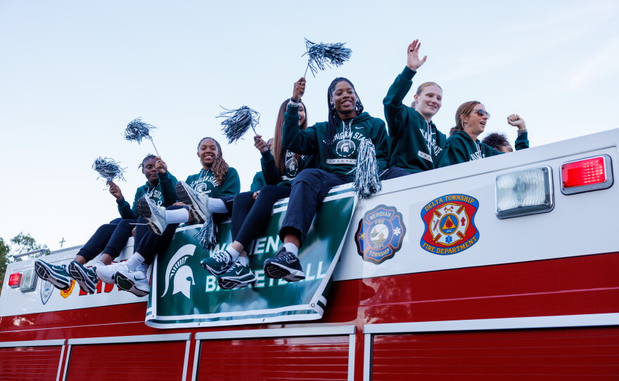 The Michigan State University women's basketball team rides a firetruck in the Michigan State University Homecoming Parade in East Lansing, Mich., on Oct. 9, 2026.