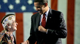 President Obama is greeted prior to speaking at the Veterans of Foreign Wars National Convention in Phoenix Monday.