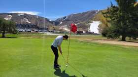 Person golfs at the Park City golf course on March 28, 2026.