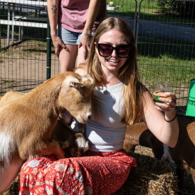 Jill Samyn finds a friend to share a drink with at Black Star Farms near Suttons Bay. (Photo: Mike Kent / Northern Michigan Journalism Collaborative)