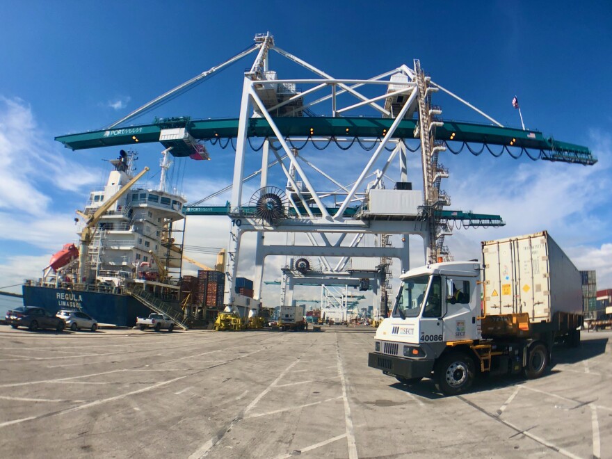 A terminal truck turns to position itself under a gantry crane to load a container onto the Regula before it departs for Nassau on Jan. 21, 2021. PortMiami has seen record trade volume thanks to a jump in imports.